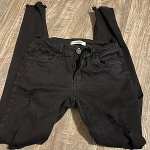 Refuge jeans with rips, gently warn